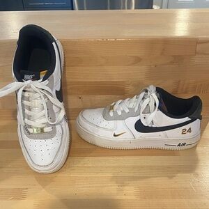 Nike White and Black Air Sneakers with Gold Accents